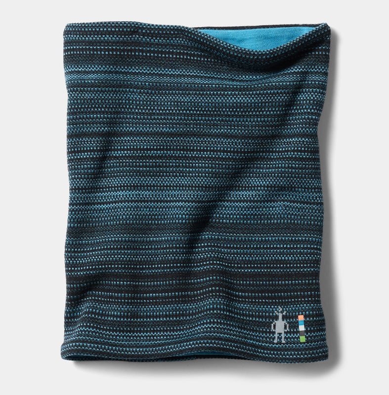 A folded knit neck gaiter in a dark teal and black striped pattern with a small embroidered robot logo near the bottom right, shown on a light gray background.