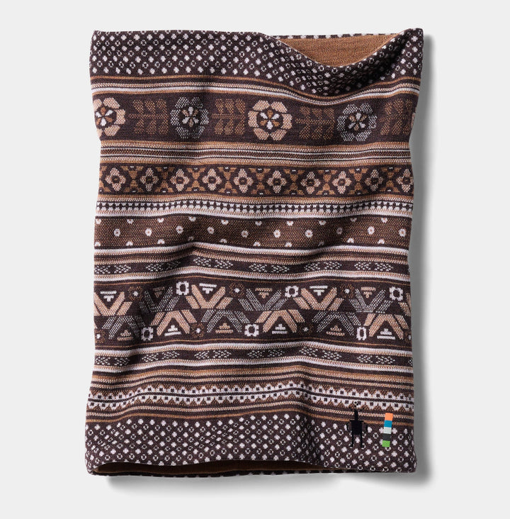 A knit cowl neck warmer with a brown, beige, and white geometric pattern, shown flat against a light gray background.