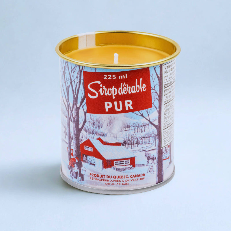 Candle in a can labeled 'Sirop d'erable Pur' on a light blue background