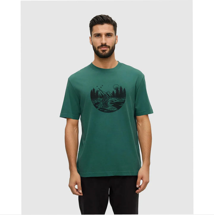 Man wearing a green t-shirt with a black graphic design on a light gray background