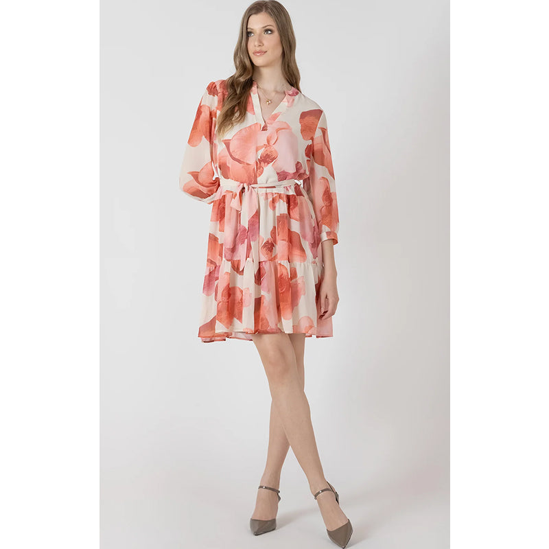 Woman wearing a floral dress on a white background