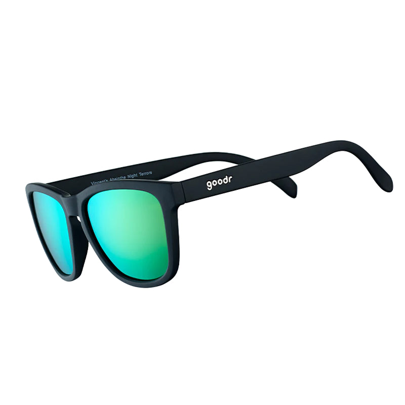 Black sunglasses with green lenses on a white background