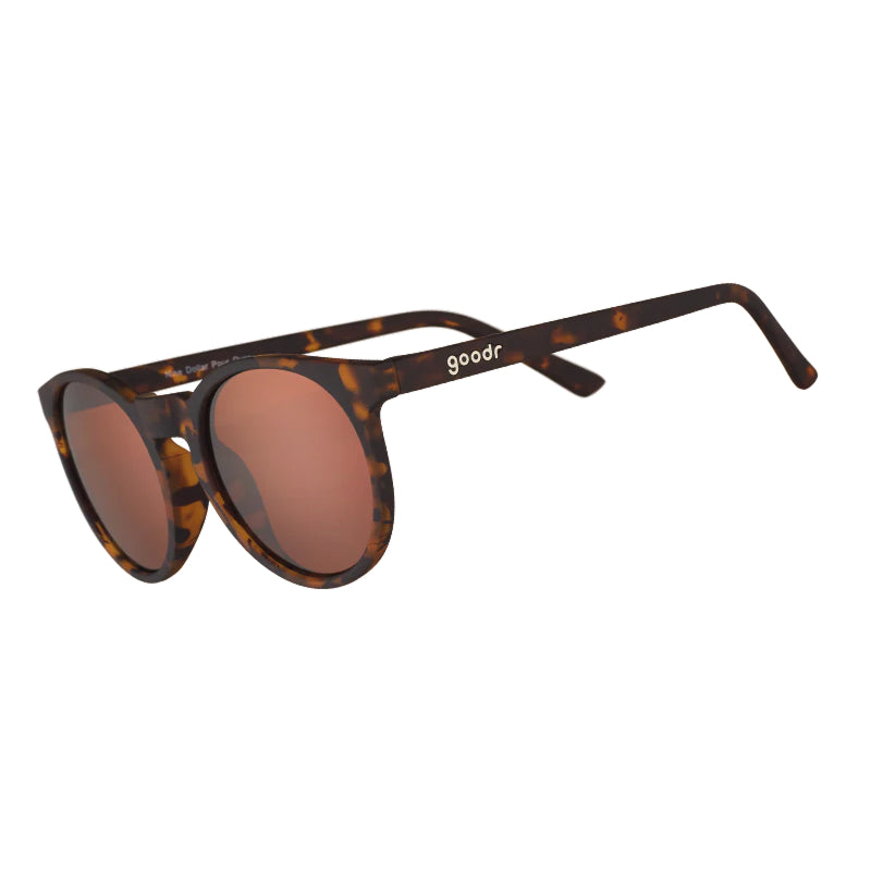 Sunglasses with tortoiseshell frame and brown lenses on a white background