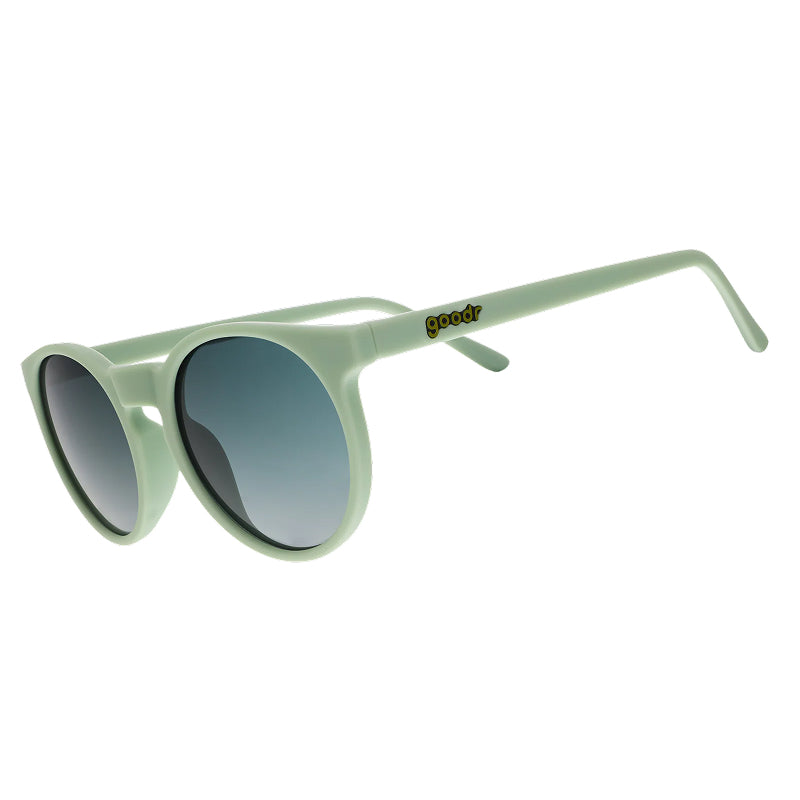Light green sunglasses with dark lenses on a white background
