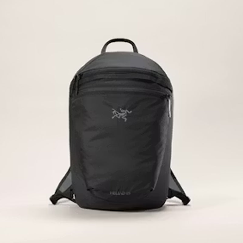 Black backpack on a beige background